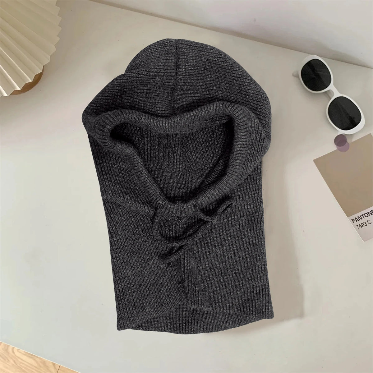 Dark grey knitted balaclava with ribbed hood and face opening
