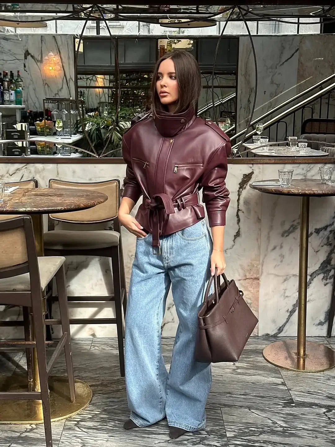 Burgundy leather-look jacket with lace-up waist cinch and zip pockets