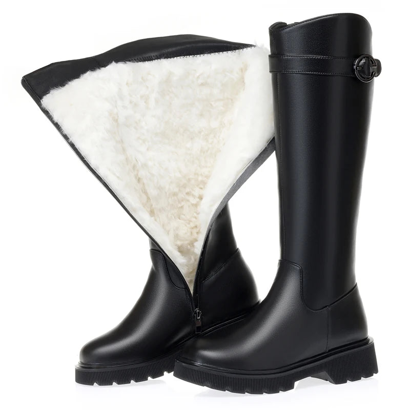 Black tall riding boots with visible white wool lining at the top and lug sole