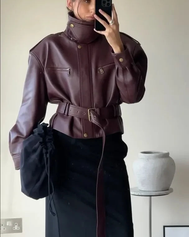 Burgundy belted jacket with snap buttons, stand collar, and zip front