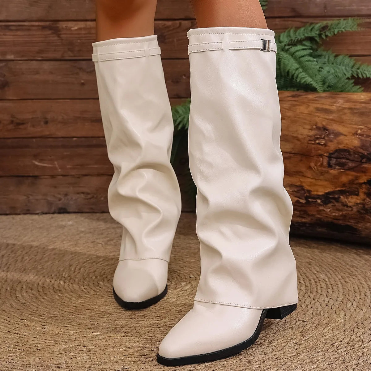 Beige foldover wide-calf knee-high boots with foldover cuff and buckle detail