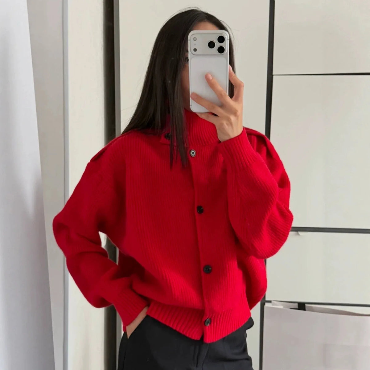 Red knit turtleneck cardigan with loose fit and front button placket