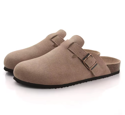 Suede buckle clog in light sand with two-strap detail and dark rubber outsole.