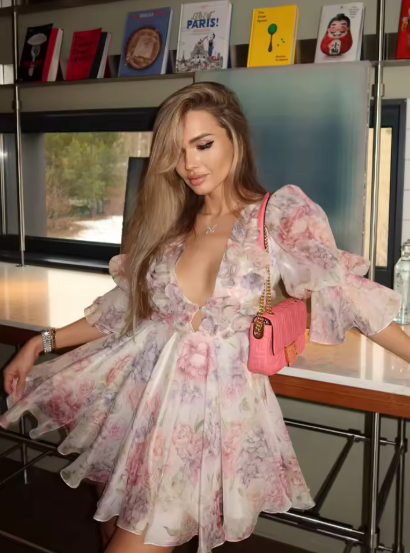 Pastel floral mini dress with deep V-neck and voluminous puff sleeves