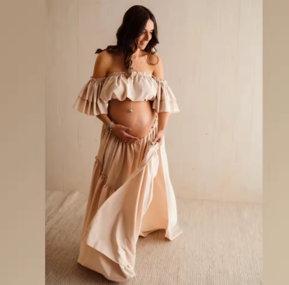 Cream off-shoulder maternity crop top with layered ruffle skirt and bow ties