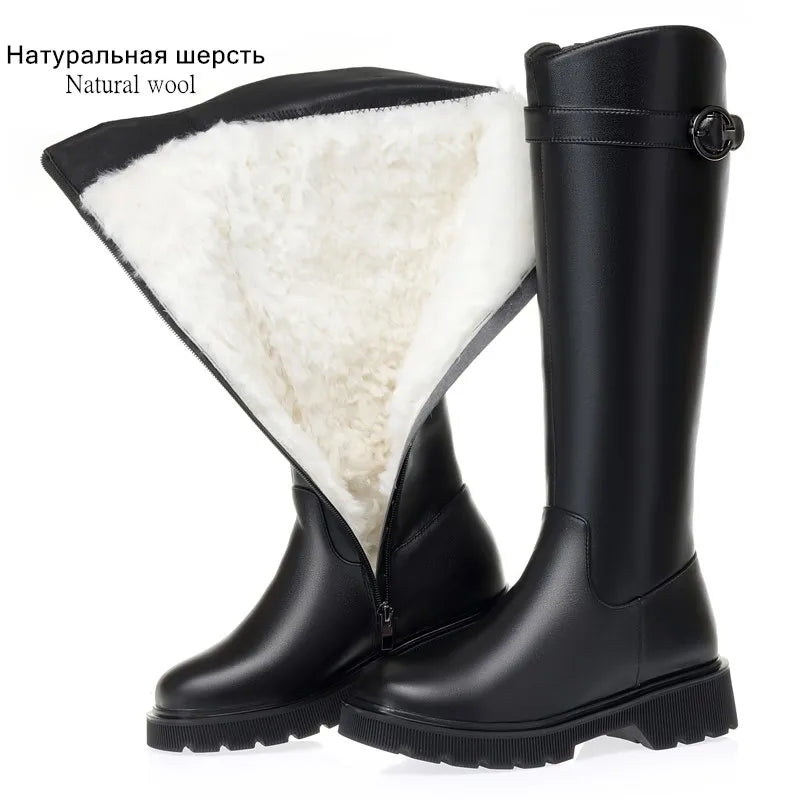 Black tall riding boots with wool lining, front zip panel, buckle strap, lug sole