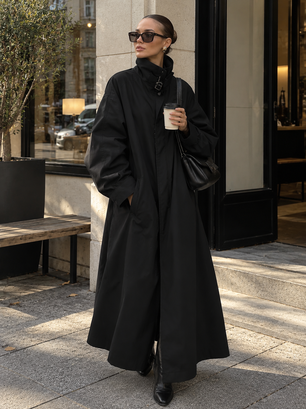 Black long trench coat with lace-up funnel neck and buttoned front