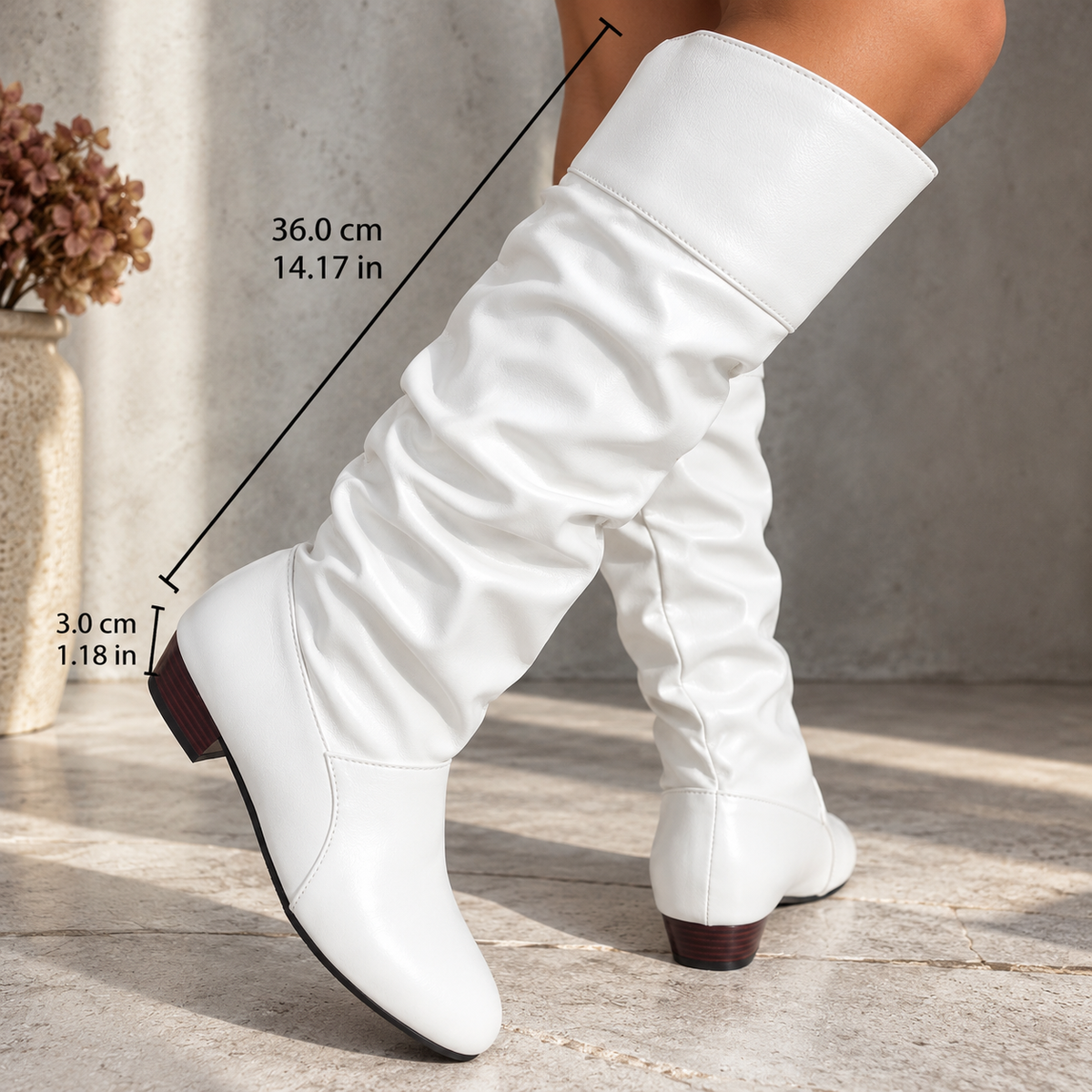 White knee-high boots with elastic-look cuff, shown with length and width markers