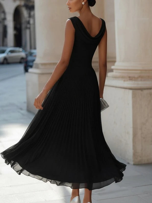 Black draped neck pleated midi dress with sleeveless cowl neckline and flowing skirt