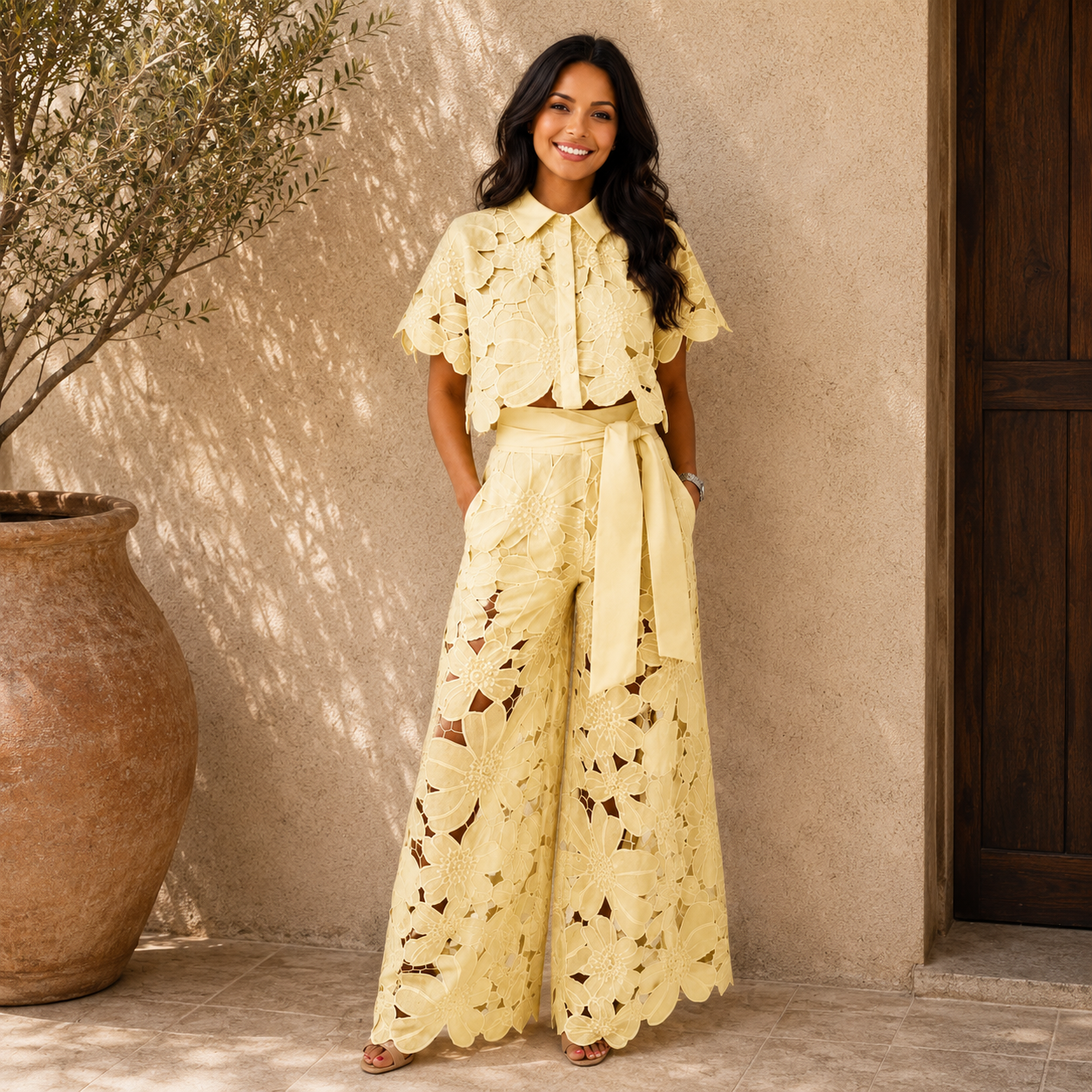 Cream/yellow lace two-piece set: short-sleeve blouse and wide-leg pants with waist tie.