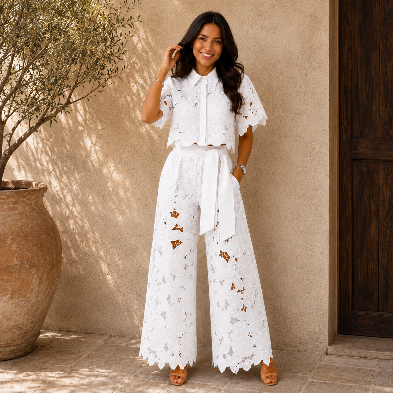 White lace two-piece set: short-sleeve blouse and wide-leg pants with waist tie.
