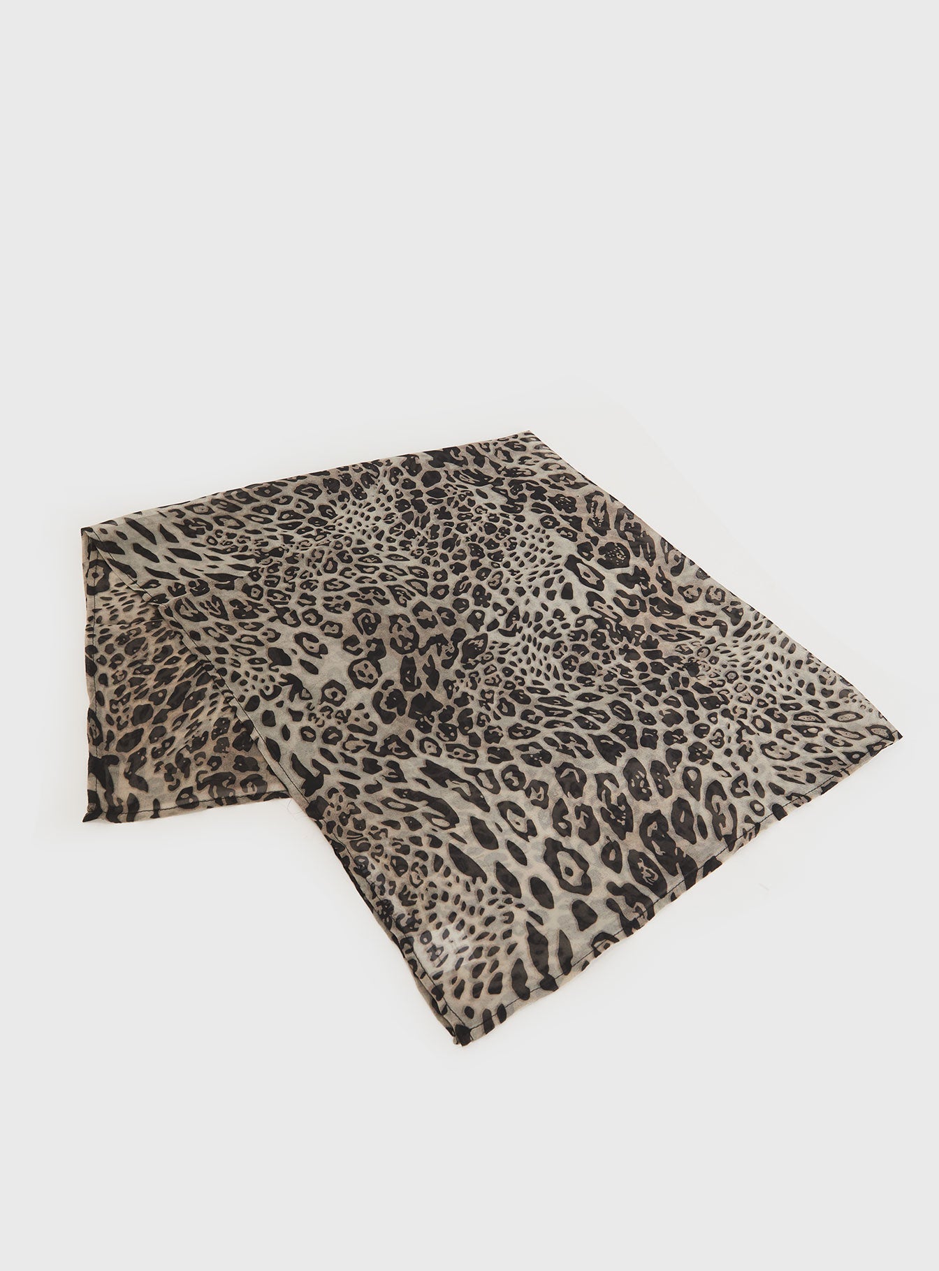 Leopard satin scarf in beige and black, folded into a compact rectangle.