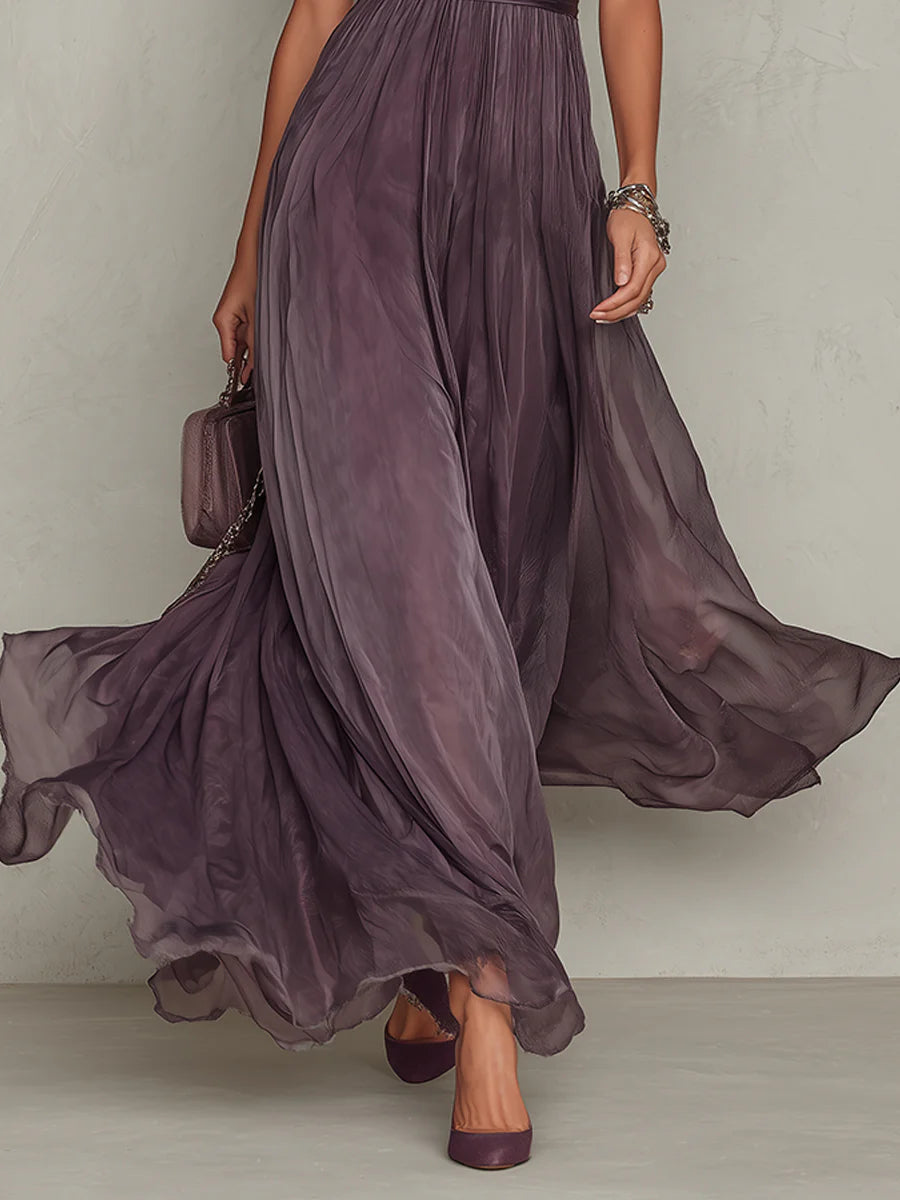 Plum purple tulle maxi dress with flowing hem, gathered waist and short puff sleeves
