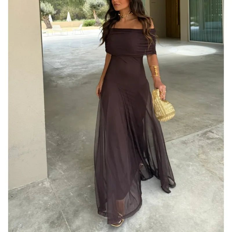 Dark brown one-shoulder sheath maxi dress with draped waist and flowing skirt