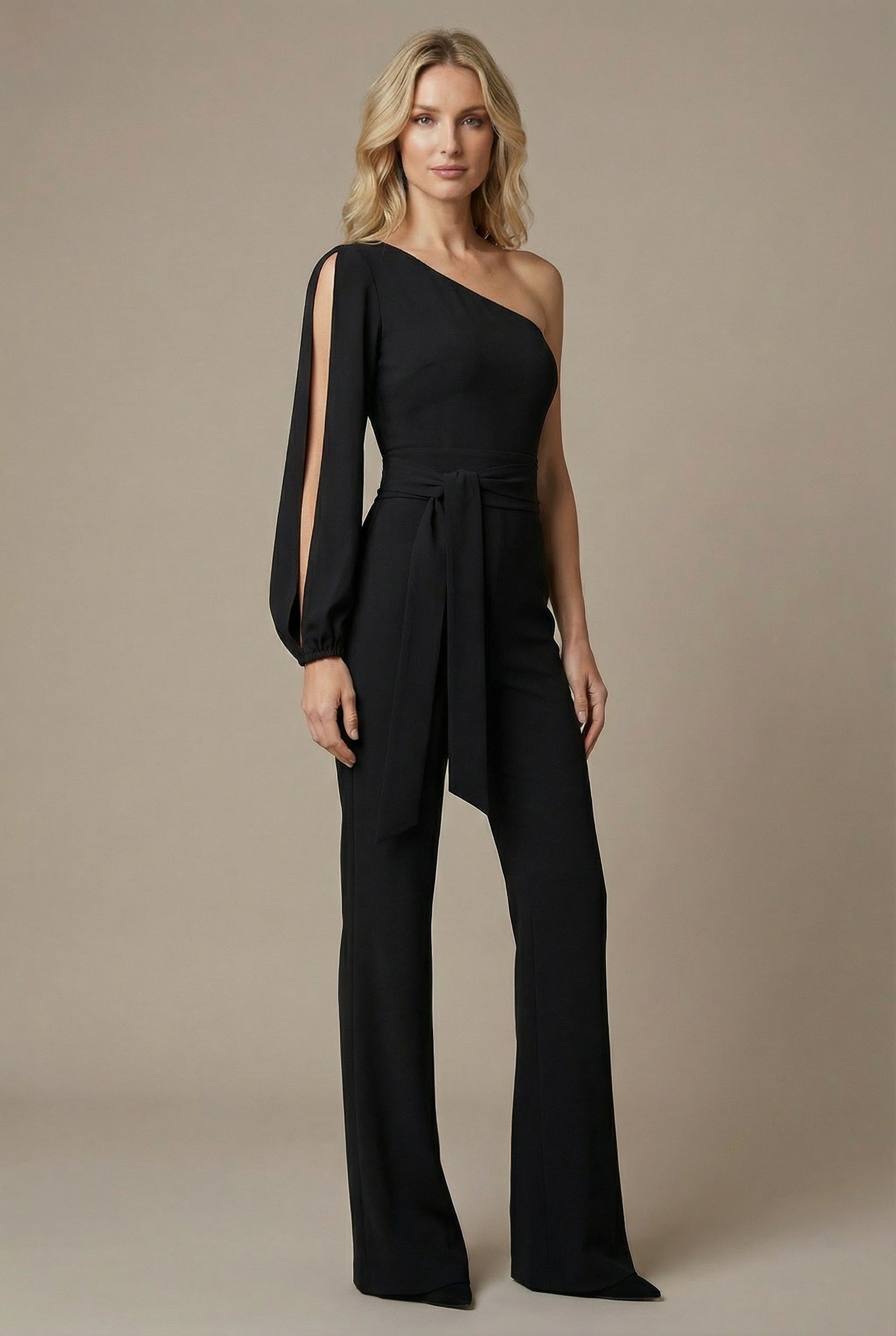 Women’s black one-shoulder wide-leg jumpsuit with tied waist and draped sleeve