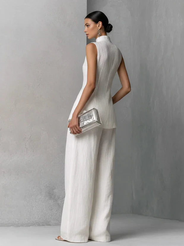 White linen sleeveless wide-leg set, side view showing high-neck top and wide pants