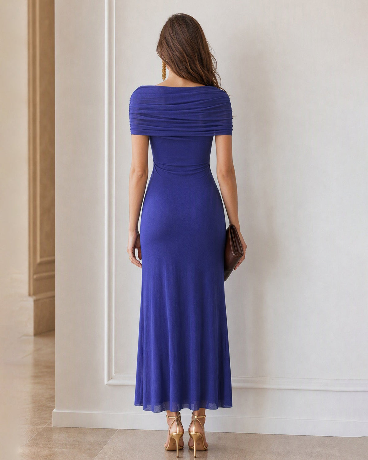 Back view of blue ruched maxi dress with off-shoulder draped neckline